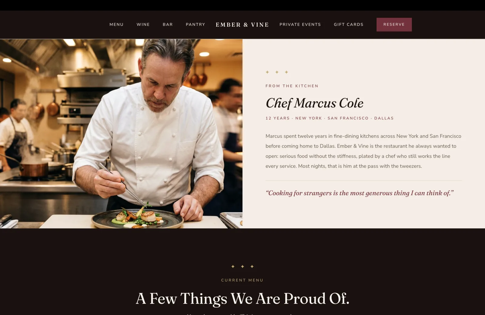 Chef section: a wide split layout. Left half is a documentary photograph of Chef Marcus Cole, a salt-and-pepper-haired chef in a clean double-breasted white coat, leaning over the pass in a busy professional kitchen, plating a seared scallop dish with tweezers. Copper sauté pans hang above him on a rail, steam rises from a pot to his left, and other cooks in dark aprons work the line behind him in soft focus. Right half on a calm pink-cream field carries a centered three-diamond gold ornament, a small burgundy eyebrow reading From the Kitchen, then a large italic serif headline reading "Chef Marcus Cole." Below the headline, a small burgundy credential row reads "12 Years, New York, San Francisco, Dallas." A short paragraph reads "Marcus spent twelve years in fine-dining kitchens across New York and San Francisco before coming home to Dallas. Ember & Vine is the restaurant he always wanted to open: serious food without the stiffness, plated by a chef who still works the line every service. Most nights, that is him at the pass with the tweezers." A thin gold rule beneath, then an italic burgundy serif pull quote: "Cooking for strangers is the most generous thing I can think of."